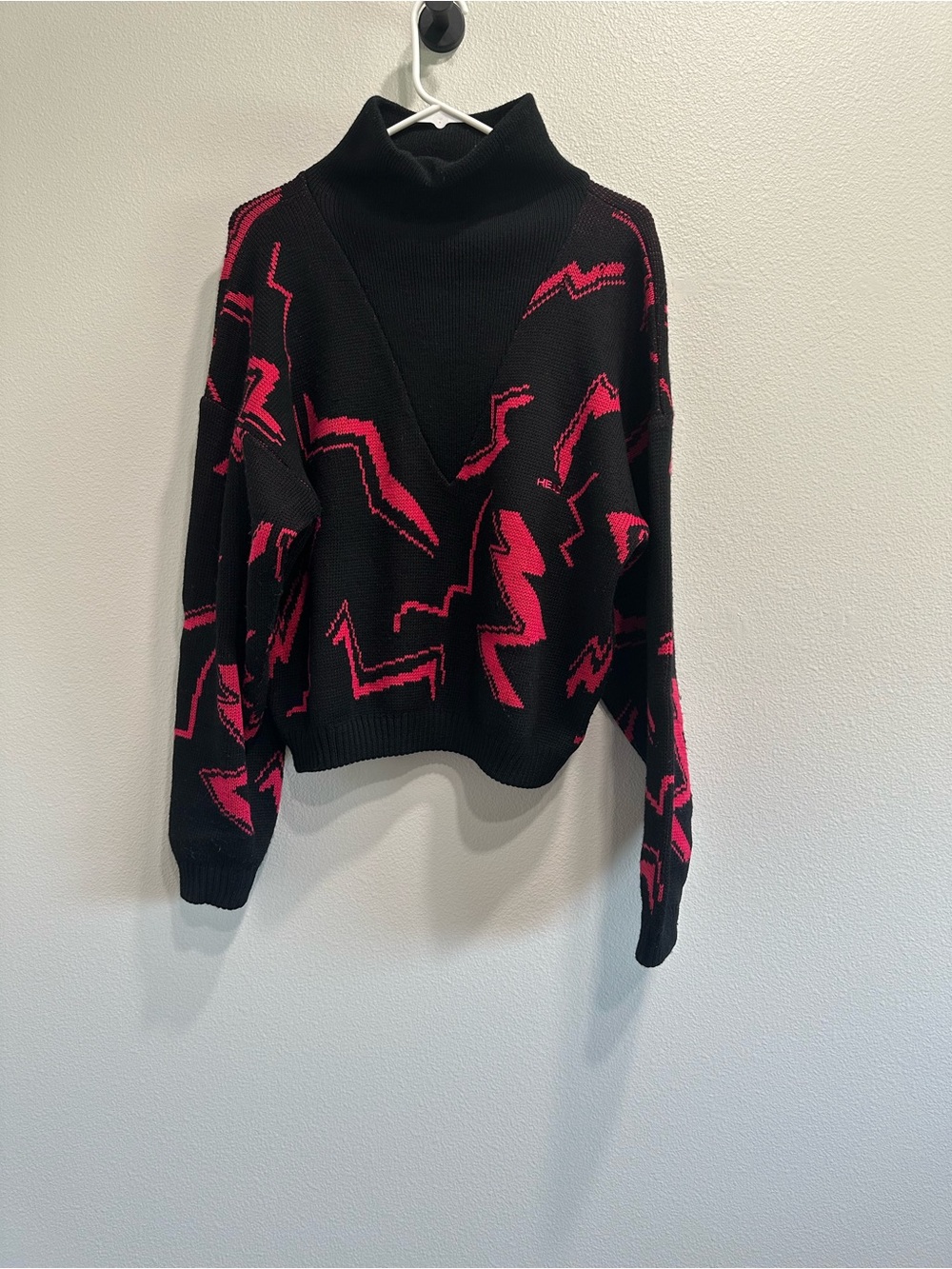 Head Black Turtleneck Sweater with Hot Pink Graphic Pattern